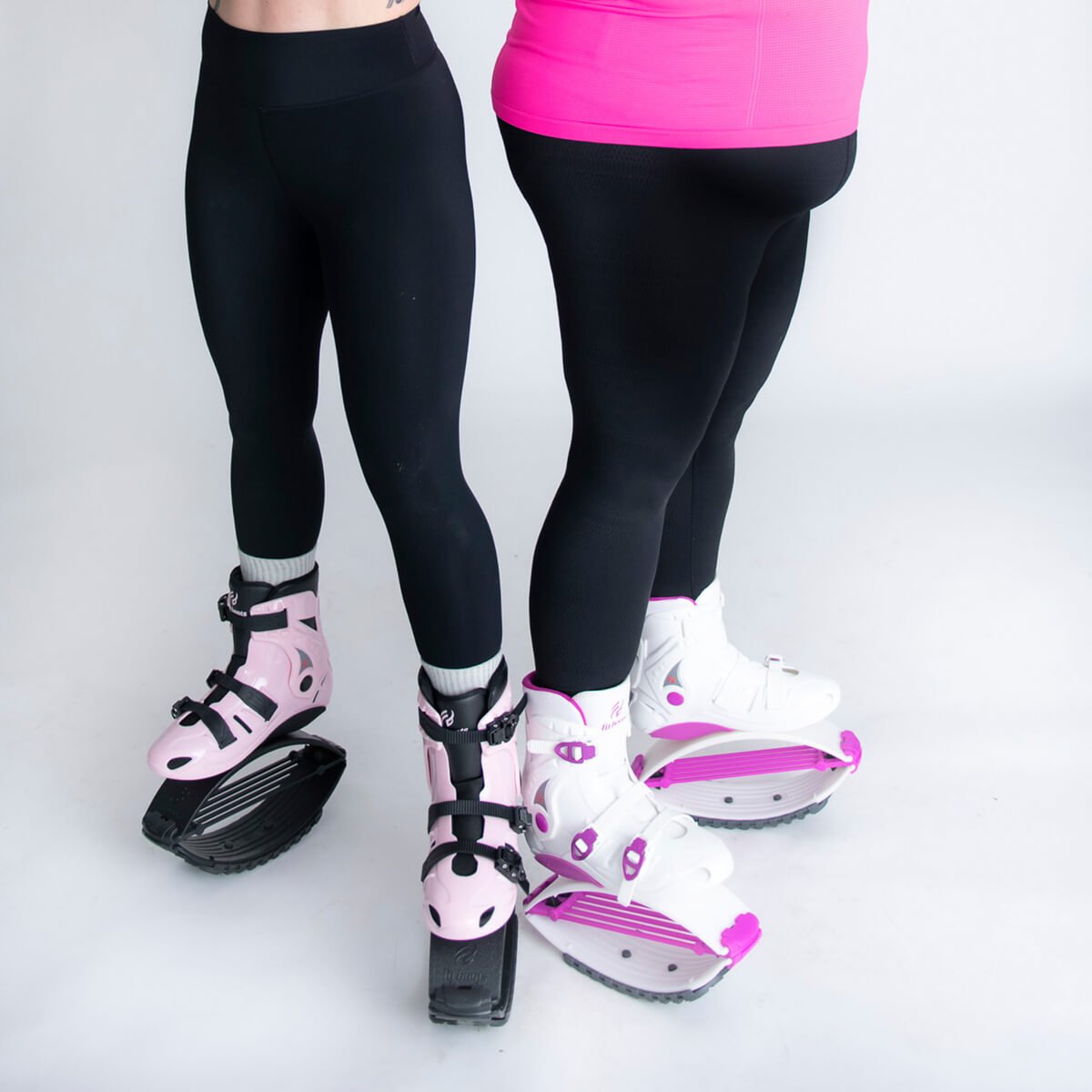 Duas pessoas lado a lado com botas Fit Boots Rebound em cor-de-rosa